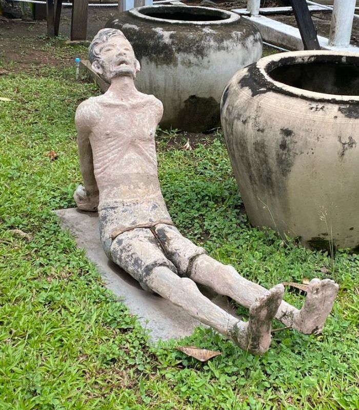 A the Tuol Sleng Genocide Museum mass grave at the Killing Fields
