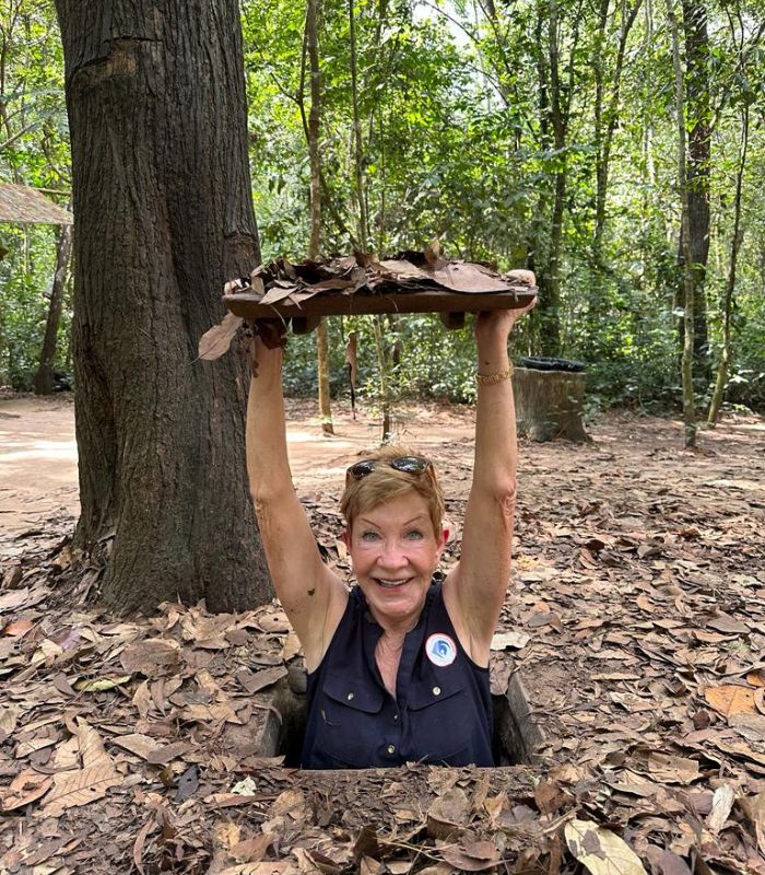 A trap door on the jungle floor leads down into the Củ Chi tunnels.