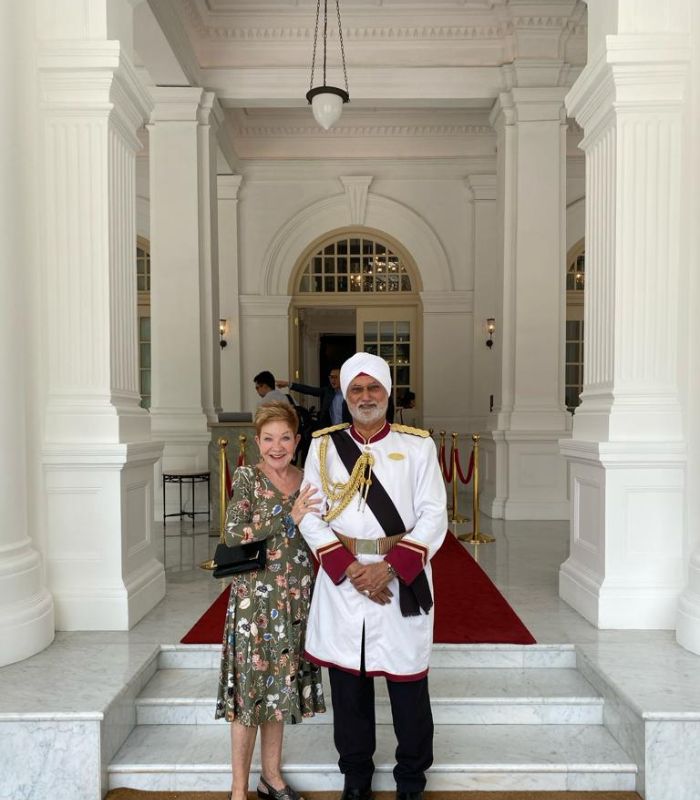 Isobel at Raffles Hotel Singapore Isobel with one of the famous doormen at Raffles Hotel in Singapore